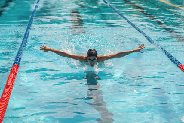 istock woman swimming in pool 1206709412