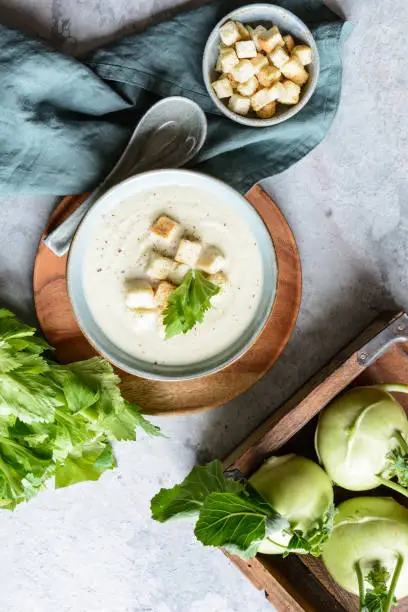 Delicious creamy celery and kohlrabi soup topped with croutons