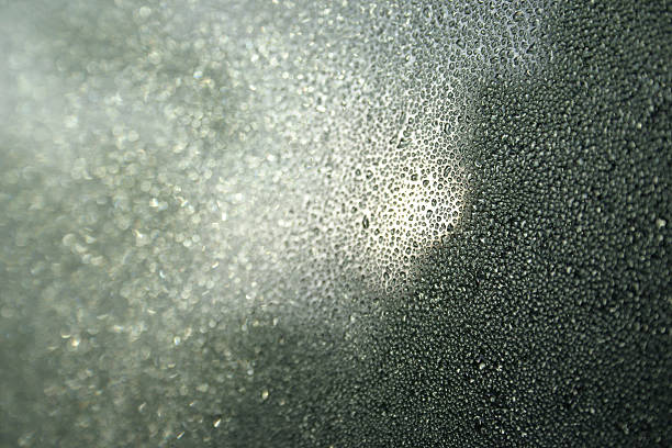 istock Morning Dewdrops on Window Reflecting Sunrise 120671446