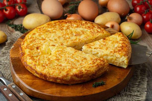 istock Spanish omelette with potatoes and onion, typical Spanish cuisine. Tortilla espanola. Rustic dark background. Top view 1206715857