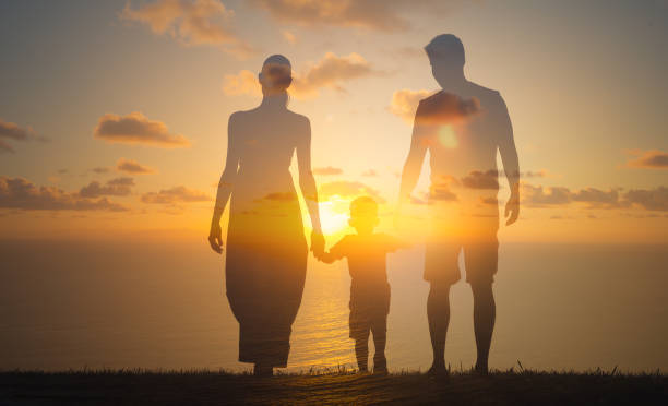 istock Happy family at sunset 1206717433