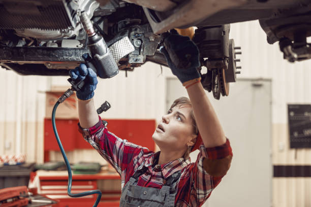 istock Serious young technician performing an auto repair 1206720338