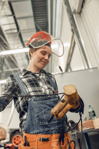 istock Young woman technician holding a repair tool 1206720436