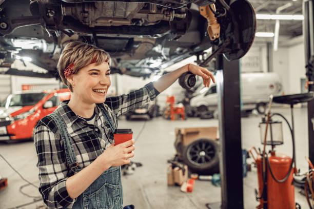 istock High-spirited woman standing in an auto workshop 1206720574