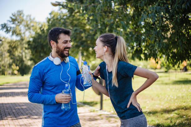 istock Two friends taking a break from running to talk and bond 1206720733