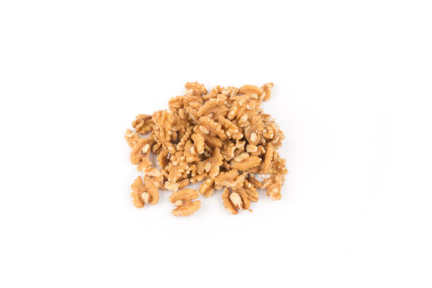 istock Close-up of walnuts on a white 1206720816