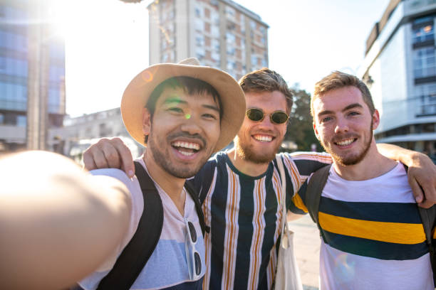 istock Happy men taking selfies during an exploration adventure 1206720913