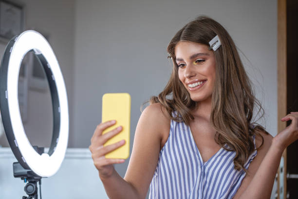 istock Gorgeous young woman taking selfies with stage makeup 1206721113