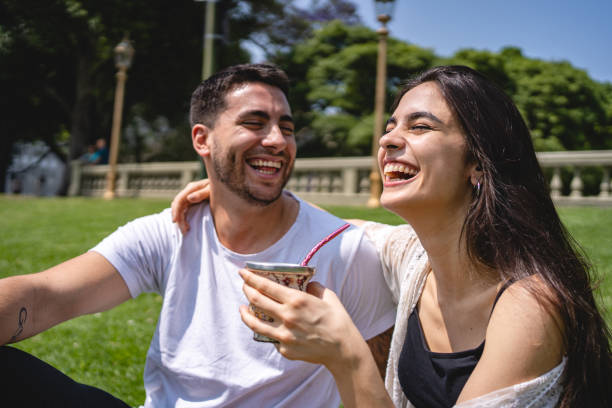 istock Couple enjoying tea together in a park 1206721689