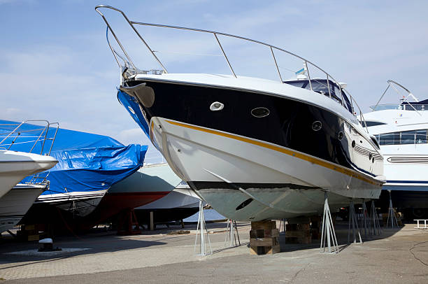 Yacht stored for the winter Recreational Yacht store up in shelves waiting for the seasons action. dry dock stock pictures, royalty-free photos & images