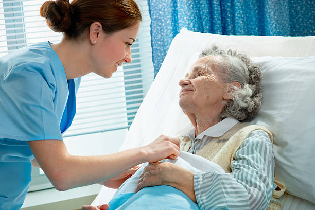 istock Elderly woman being cared for by female nurse 120672193