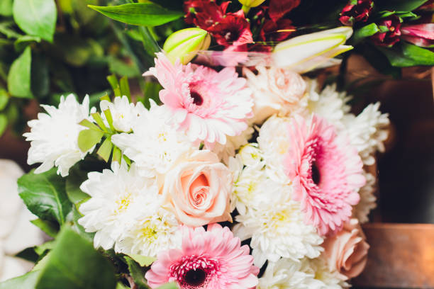 istock Flowers frame on white wooden background. Top view with copy space. 1206722030