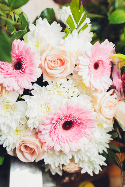istock Flowers frame on white wooden background. Top view with copy space. 1206722039