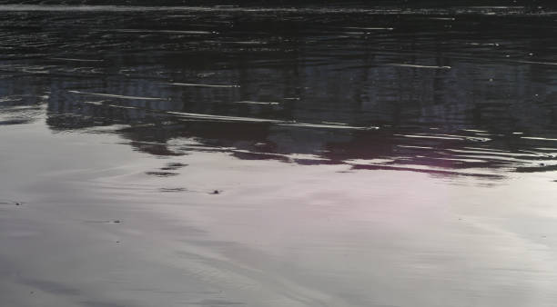 istock Watewater textures and reflections on a cold winters day at the beach, 1206722250