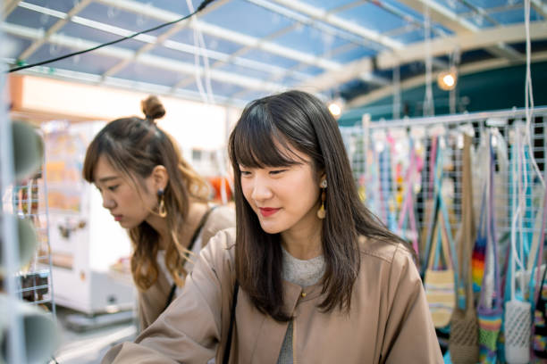 istock Young female friends shopping at accessory store 1206723421