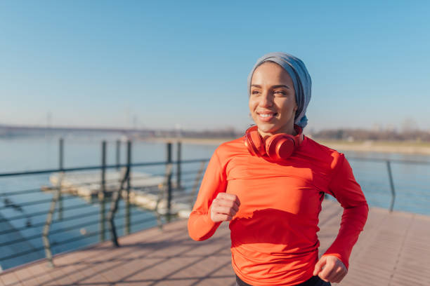 istock Beautiful young woman running 1206727240