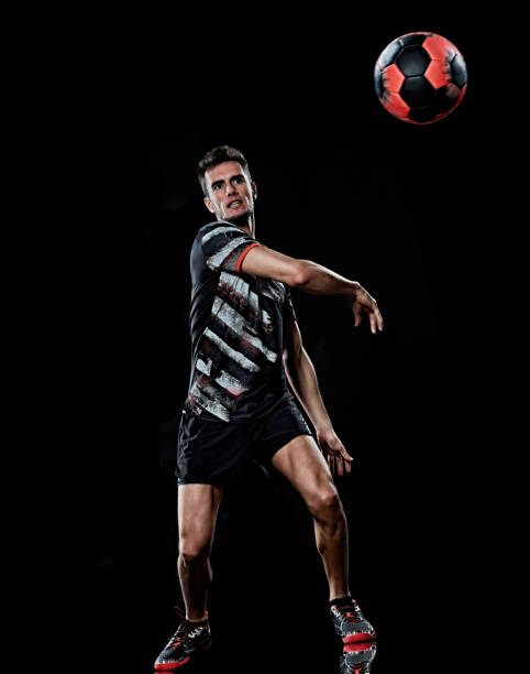 istock caucasian young handball player man isolated black background 1206727906