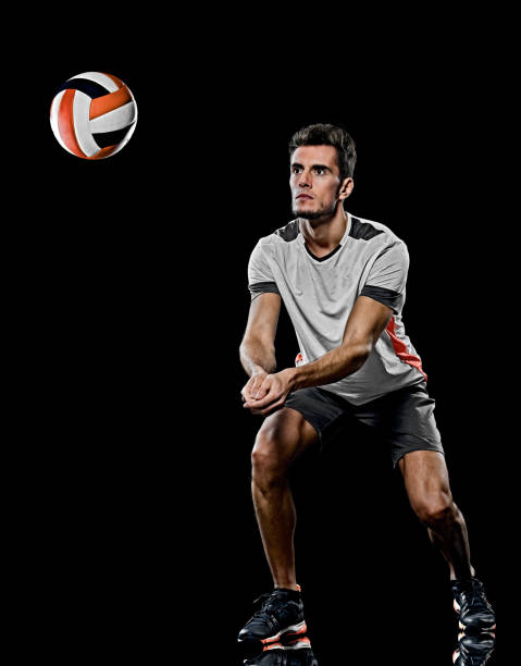 istock caucasian young volley ball  player manisolated black background 1206727912