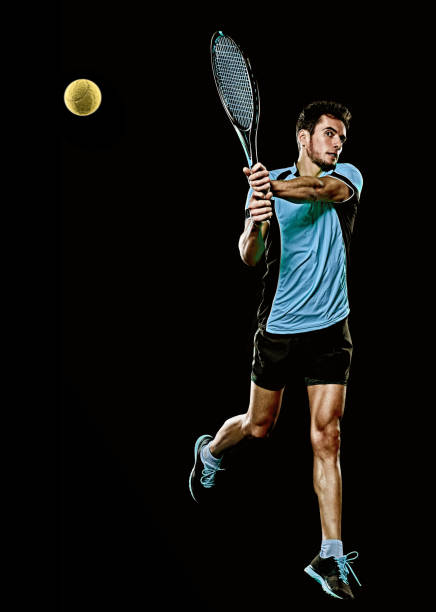 istock caucasian young tennis player man isolated black background 1206727914