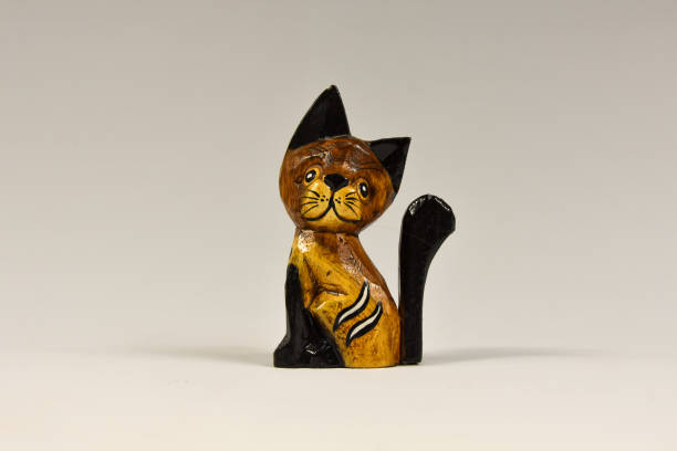 istock vintage wooden kitten figurine on a white background 1206728295