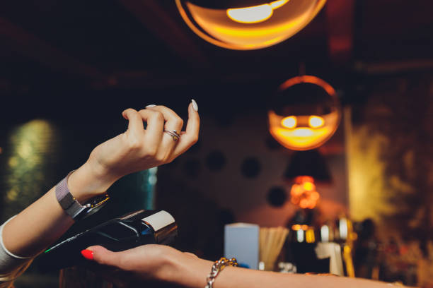 istock Woman pay by smart watch with NFC technology. 1206728920