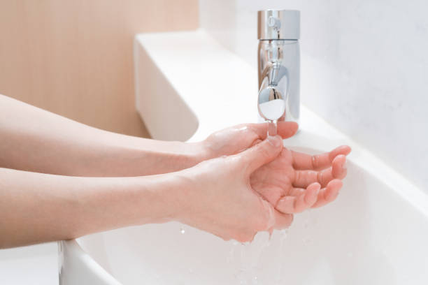istock Asian woman washing hands 1206731390