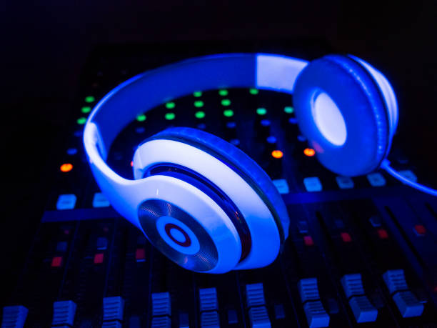 istock Headset in fluorescent UV colors on DJ console. 1206731607
