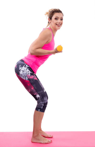 istock Mature woman exercises with dumbbells 1206731621
