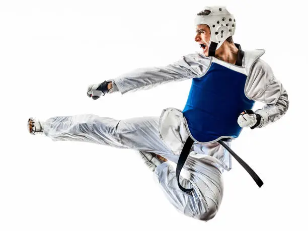 one caucasian man practicing Taekwondo  in studio  isolated on white background