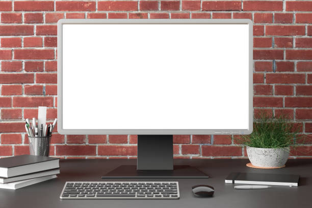 istock Workspace with blank computer monitor screen mock up. 1206736259