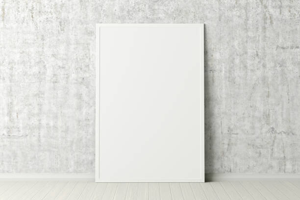 istock Blank poster frame mock up standing on the floor next to wall 1206736272