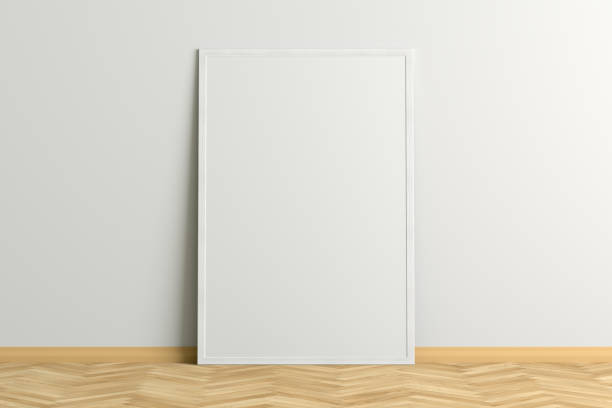 istock Blank poster frame mock up standing on the floor next to wall 1206736297
