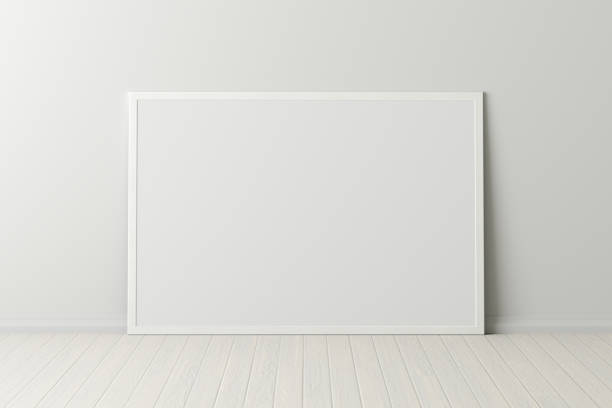 istock Blank poster frame mock up standing on the floor next to wall 1206736340
