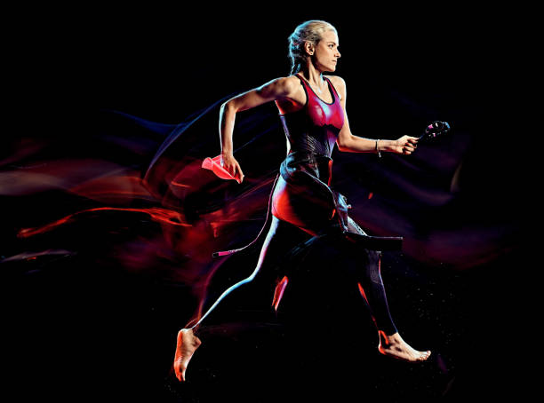 istock woman triathlon triathlete isolated black background 1206737043