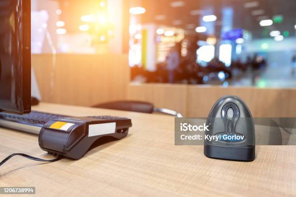 Emty Cashier Desk Counter Pos Terminal With Barcode Scanner Receipt Printer Wallet And Credit Card Reader Equipment Payment Trade Through Mobile And Wireless Nfc Technology Workplace And Career Stock Photo - Download Image Now