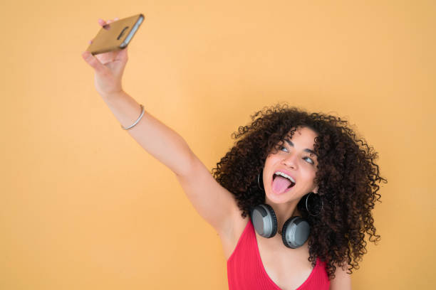 istock Afro woman taking selfies with phone. 1206740104