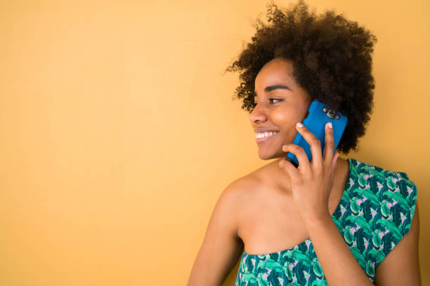 istock Young afro woman talking on the phone. 1206740107