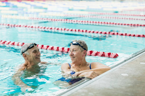 istock Senior couple exercising together, swimming laps 1206741017