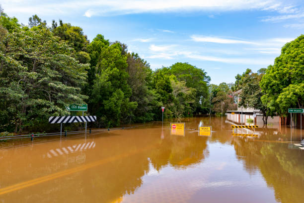 Flood Sign Under Water in the Lismore CBD Flood sign on a road under water near the Lismore, NSW, central business district new south wales stock pictures, royalty-free photos & images