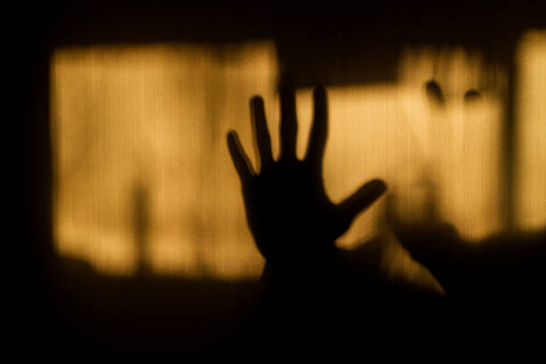 istock A hand gesture showing refusal in silhouette on the wall 1206745786