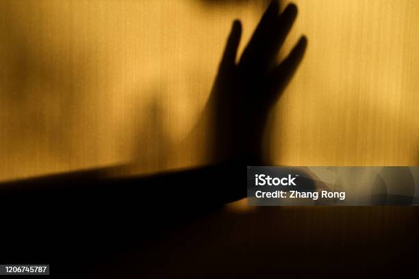 A Hand Gesture Showing Refusal In Silhouette On The Wall Stock Photo - Download Image Now