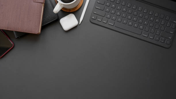 istock Overhead shot of dark modern workplace with copy space on black table background 1206748641