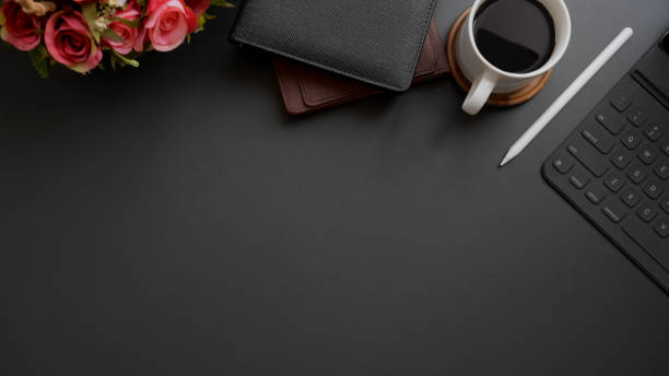 istock Top view of dark modern workplace with copy space on black table background 1206748776
