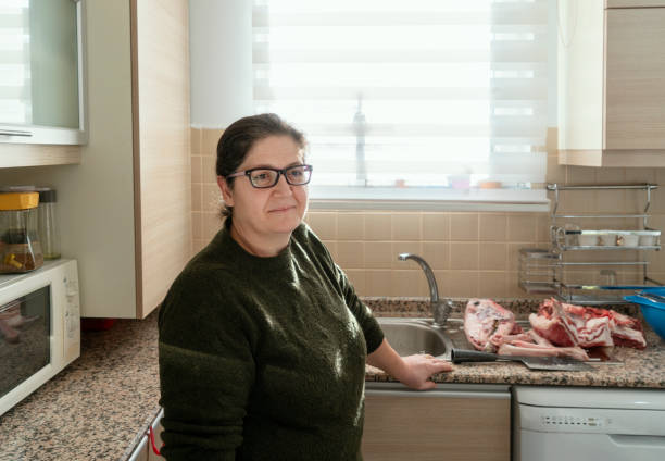 istock Mature woman working in the kitchen 1206750714