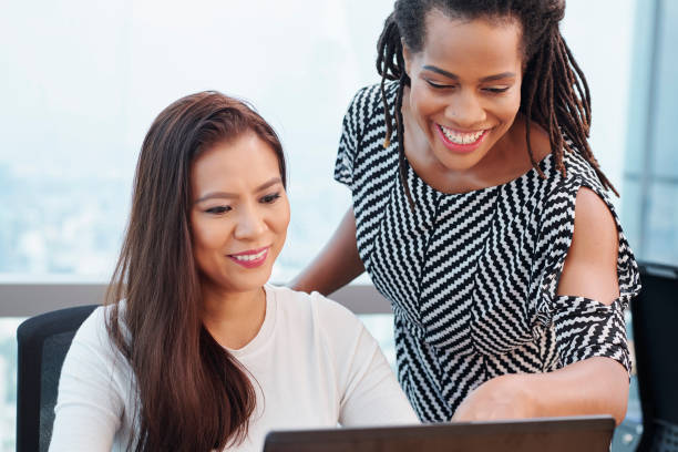istock Businesswoman helping colleague 1206753771