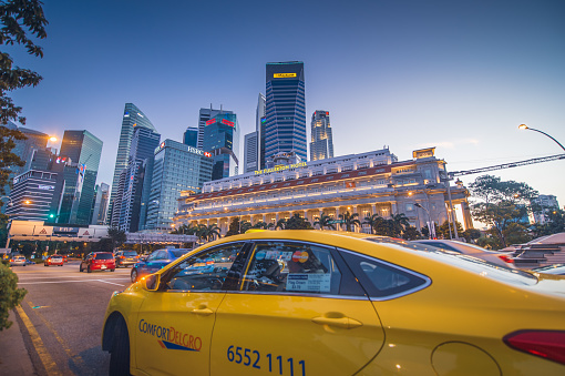 singapore , marina bay - July 20 , 2014: Taxi waiting People enjoying their weekend with Singapore's famous view of marina bay is a popular tourist attraction in the Marina District of Singapore.