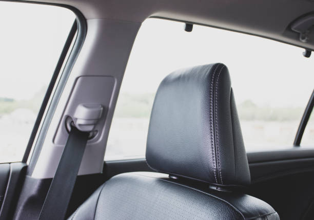 istock Headrest of black leather car seat. 1206762472