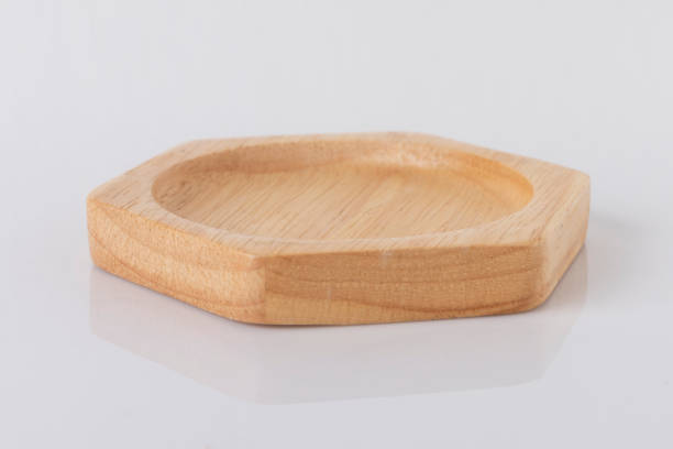 istock Hexagon shaped wooden tray on a white background 1206763254