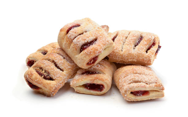 Pile of fresh cookies with cherry jam isolated Pile of fresh cookies with cherry jam isolated on a white background. strudel stock pictures, royalty-free photos & images