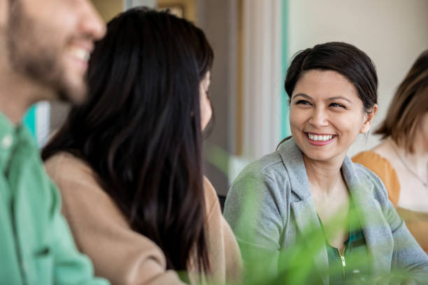 istock Diverse group of professional millennials in modern workplace brainstorming ideas together 1206765699